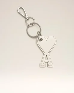 Ami de Coeur Schlüsselanhänger aus silberfarbenem Metall Grau Unisex GebüRstetes
