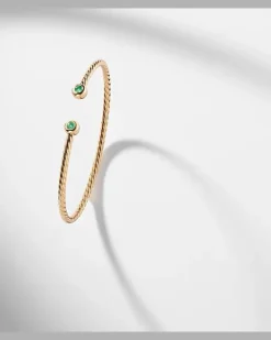 Armreif Cablespira® Flex Micro aus 18kt Gelbgold mit Smaragden