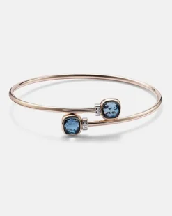 Armreif Nudo aus 18kt Rosé- und Weißgold mit Diamanten und London Blue Topas