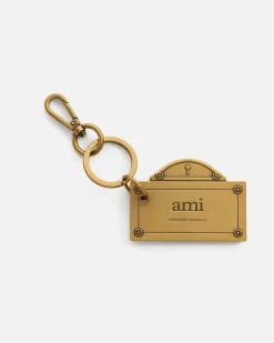 Street Schlüsselanhänger in Gold mit Plättchen Gelb Unisex GebüRstetes