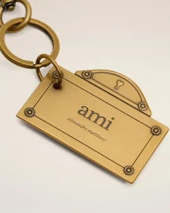 Street Schlüsselanhänger in Gold mit Plättchen Gelb Unisex GebüRstetes